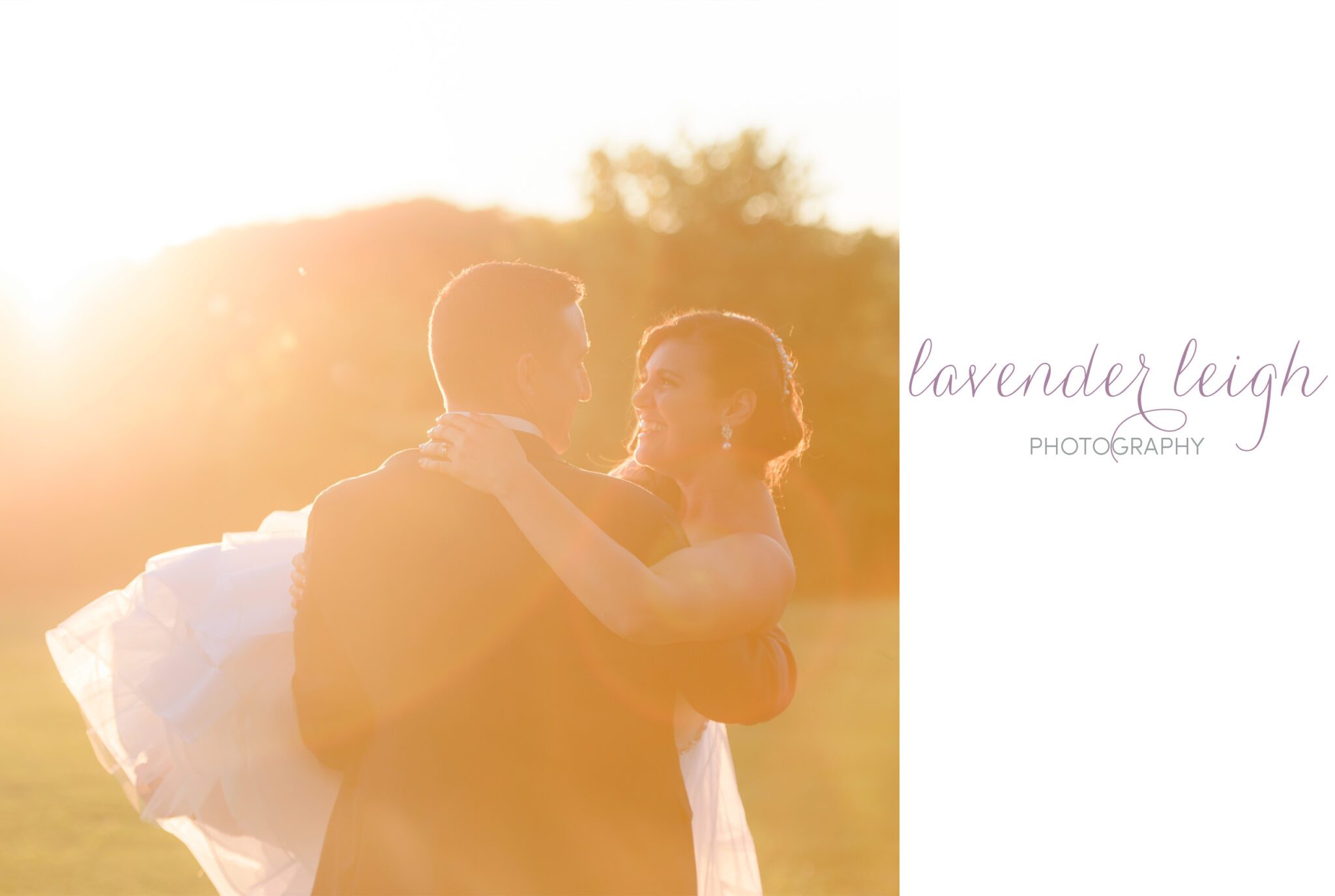 A groom carries his bride off into the golden sunset on their wedding day