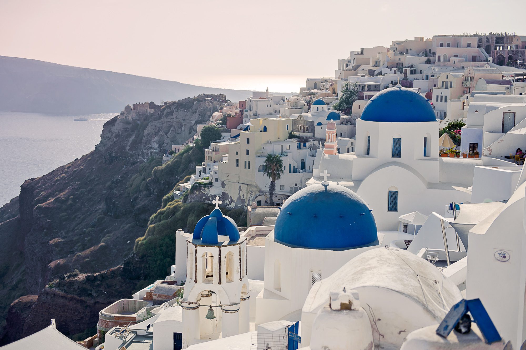 the famous blue-domed churches in Santorini, Greece