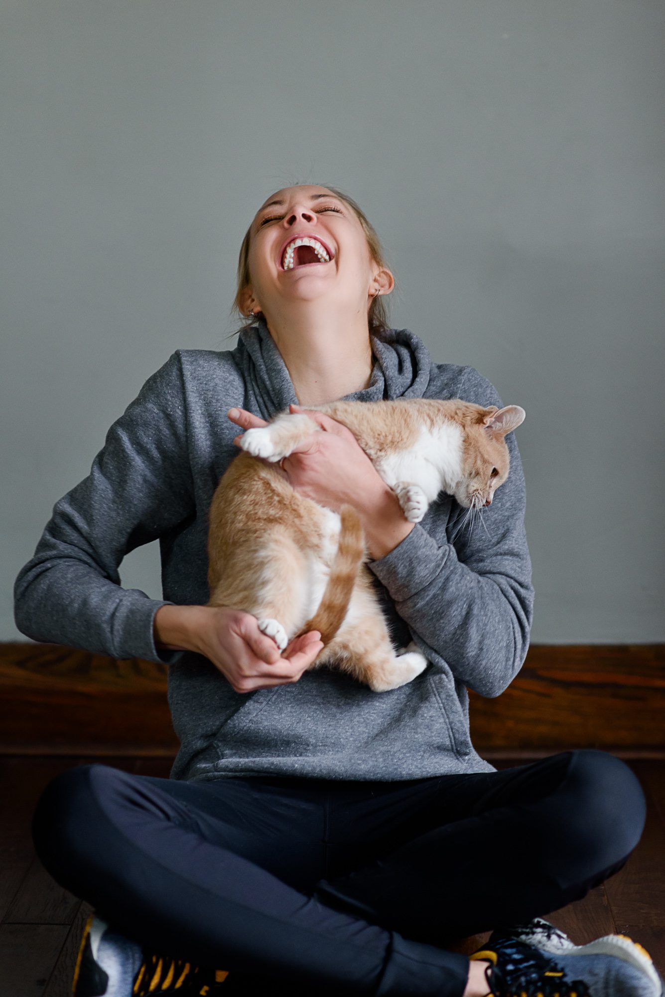 Leigh of Lavender Leigh Photography holding her cat, Petey