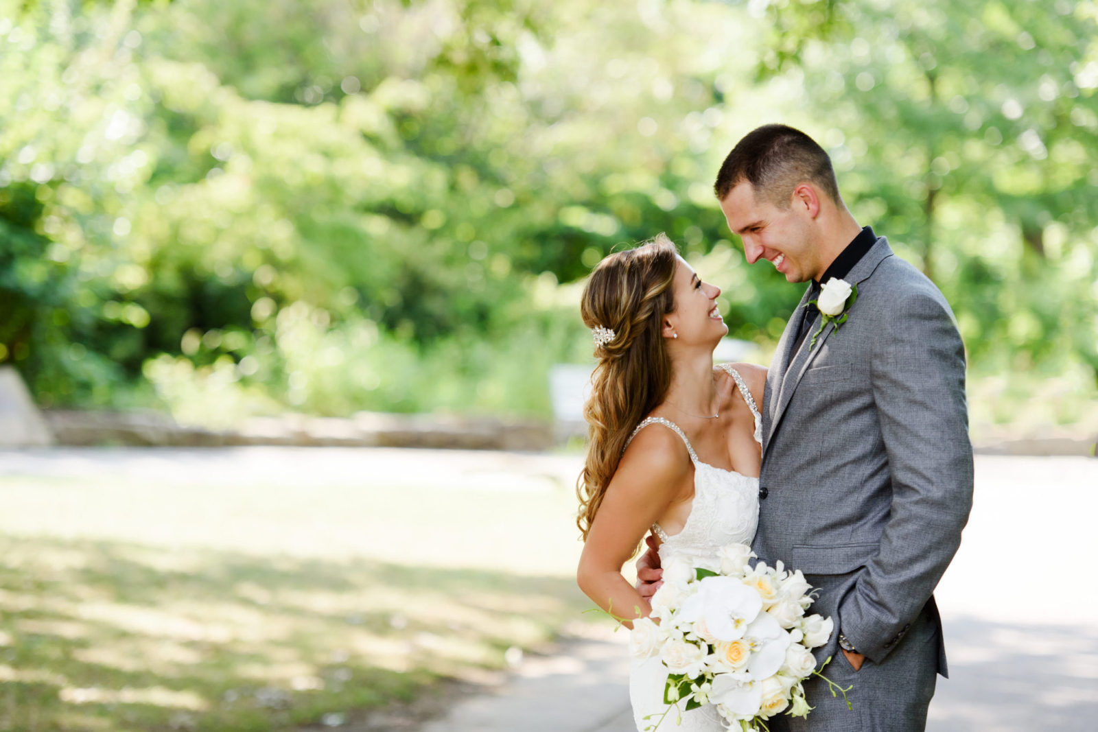 a bride and groom enjoying a moment together at Point State Park in Pittsburgh, Pennsylvania