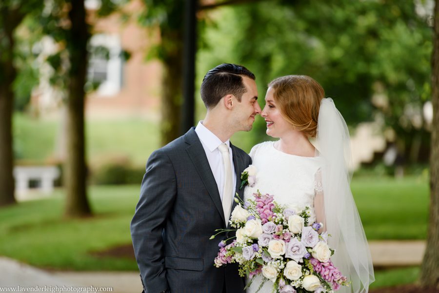 <alt>bride and groom laughing on the campus of Washington and Jefferson College in Washington, Pennsylvania</alt>