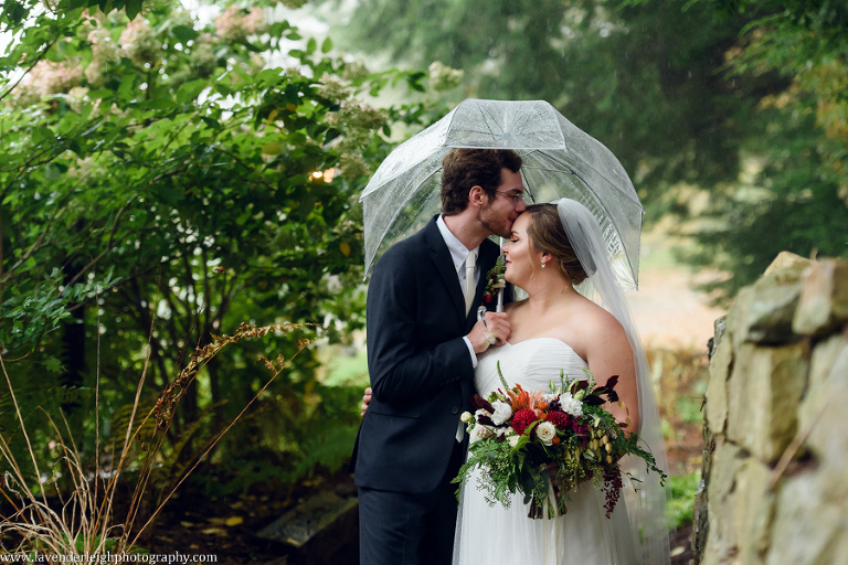 <alt> Groom kissing bride on forehead at Hidden Valley, Pennsylvania</alt>