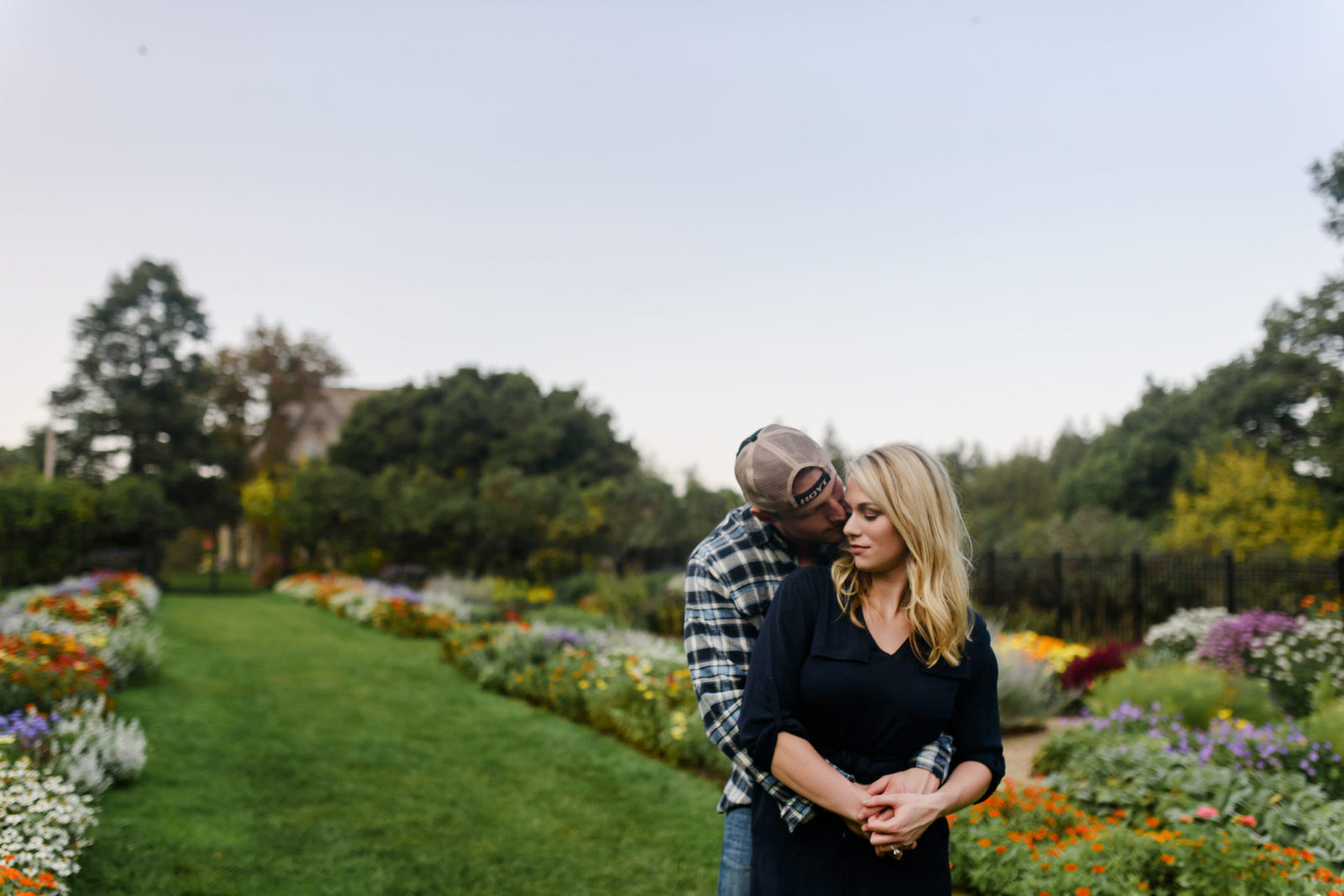 engaged couple hugging in the garden of Hartwood Acres in Pittsburgh, Pennsylvania