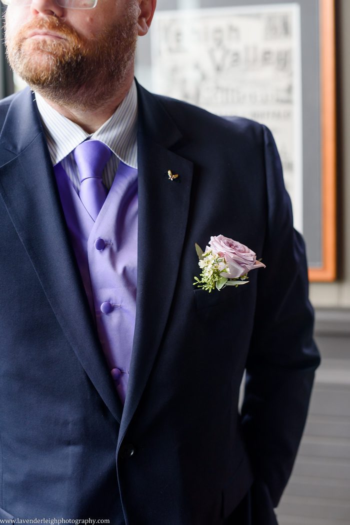 <alt> groom wearing a purple rose boutonniere at The Grand Concourse in in Pittsburgh, Pennsylvania</alt>