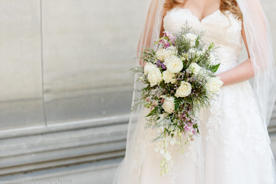 <alt> bride holding her unique greenery bouquet at Carnegie Mellon in Oakland, Pennsylvania</alt>