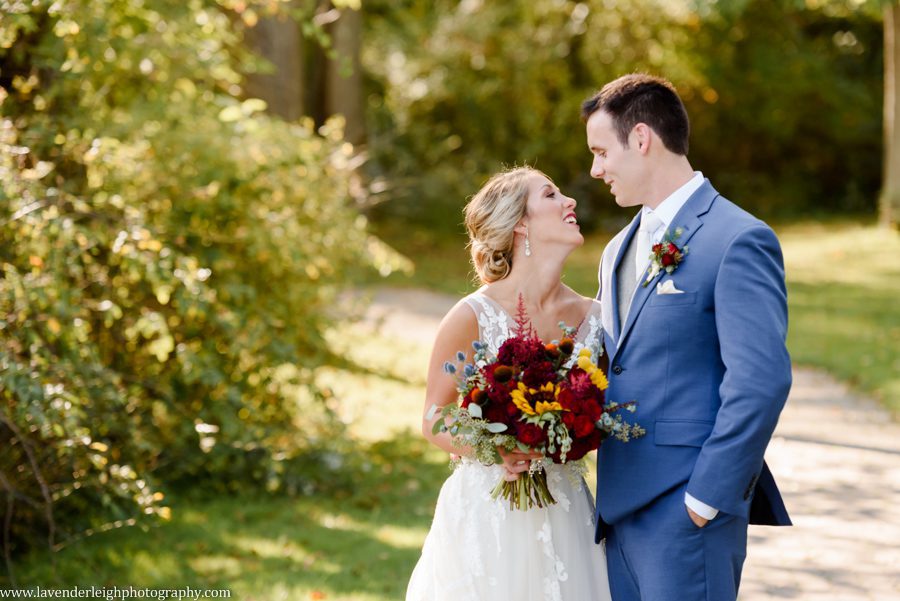 <alt> Bride smiling at her groom at Twin Lakes Park in Latrobe, Pennsylvania</alt>