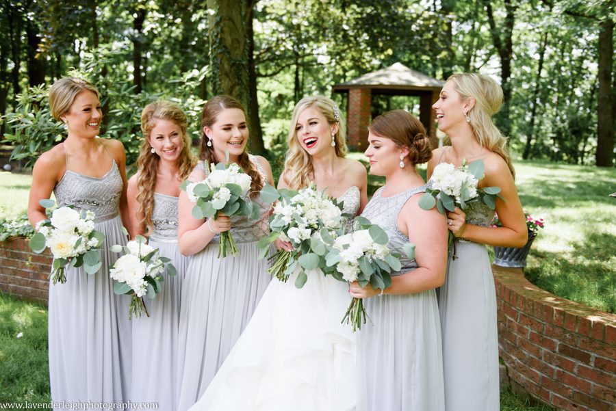 <alt> bride laughing with her bridesmaids in Rosslyn Farms, Pennsylvania</alt>