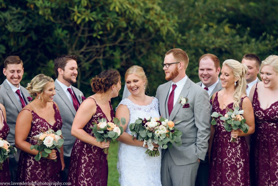 <alt> bride and groom laughing with their bridal party at Chestnut Ridge Golf Resort and Conference Center in Blairsville, Pennsylvania</alt>