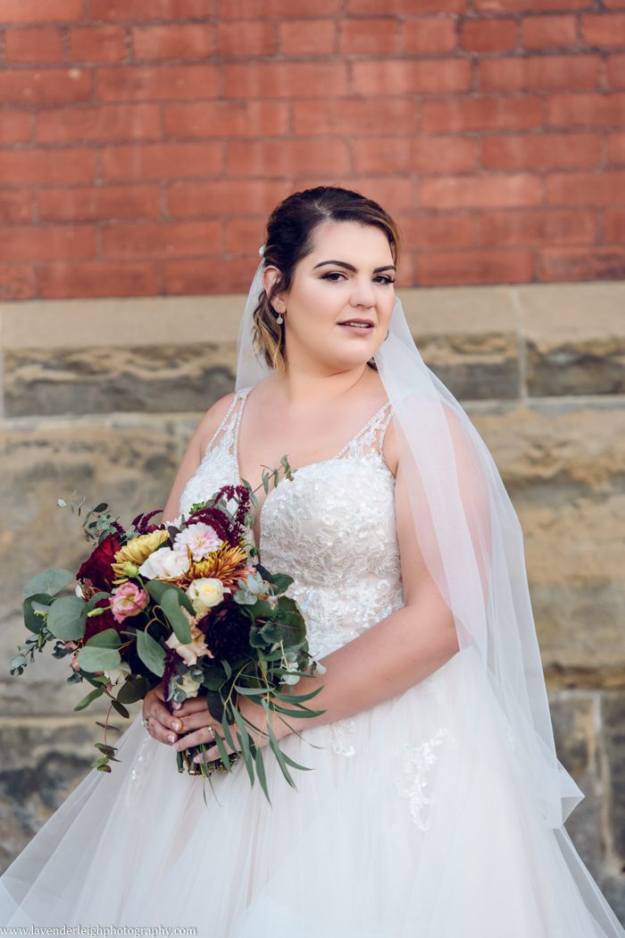 <alt> bride holding her bouquet at the Heinz History Centerin Pittsburgh, Pennsylvania</alt>