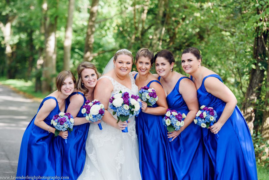 <alt> A bride being hugged by her bridesmaids in Pittsburgh, Pennsylvania</alt>