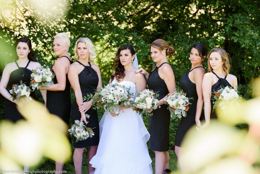 <alt> A bride posing with her bridesmaids in Erie Pennsylvania</alt>