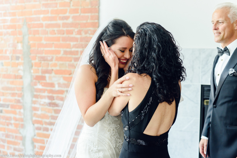 The bride cries when she turns around to show herself in her dress to her mother.