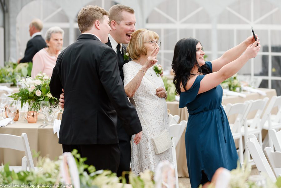 Grandmother taking selfie at a wedding at the Pittsburgh Botanic Garden