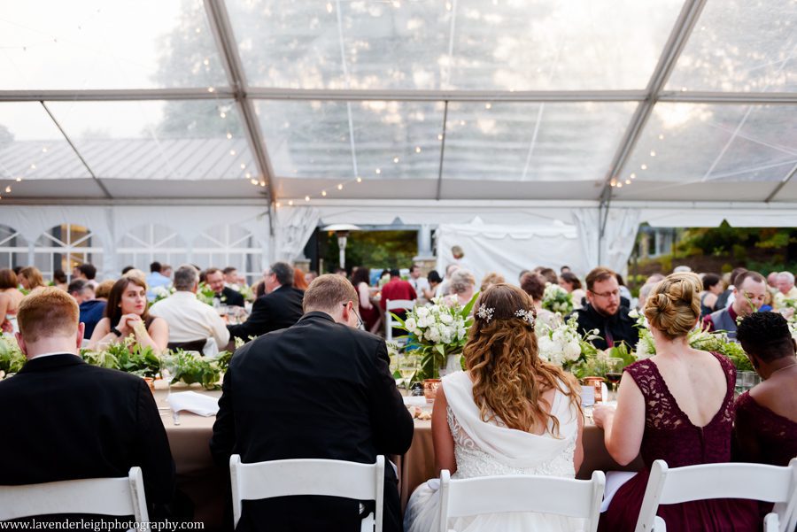 Guests' laughing at the best man's toast at the Pittsburgh Botanic Garden wedding reception