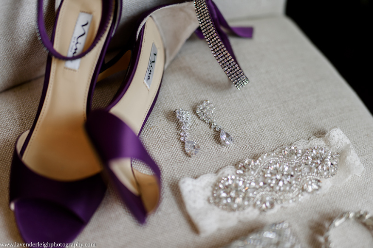 Wedding shoes, earrings and the garter details by Lavender Leigh Photography