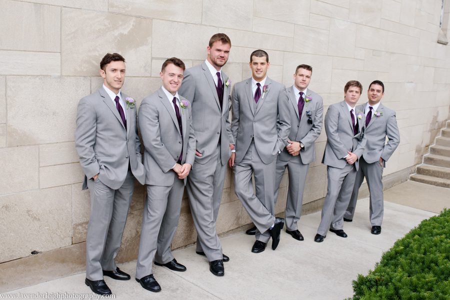 The groom hanging out with his groomsmen before the wedding ceremony