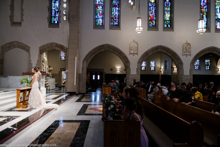 Bride and Groom stand on altar at Wedding Ceremony