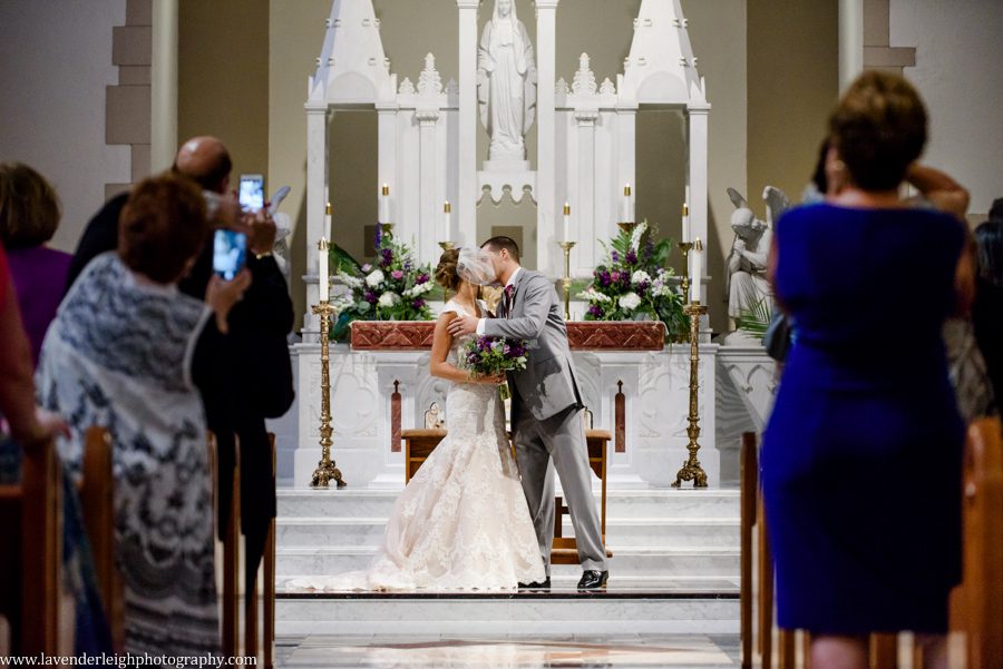 Bride and Groom Kiss at a Wedding Ceremony at the Immaculate Conception Parish in Washington, Pennsylvania