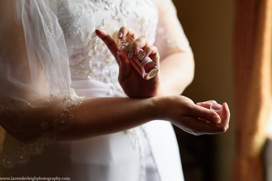 Bride Putting on Perfume