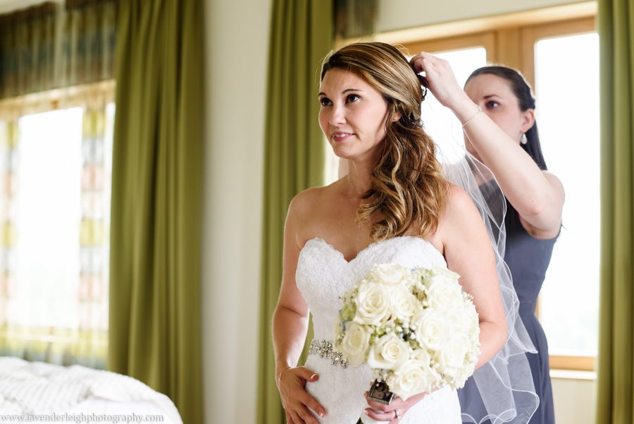 Bridesmaid Putting on Bride's Veil