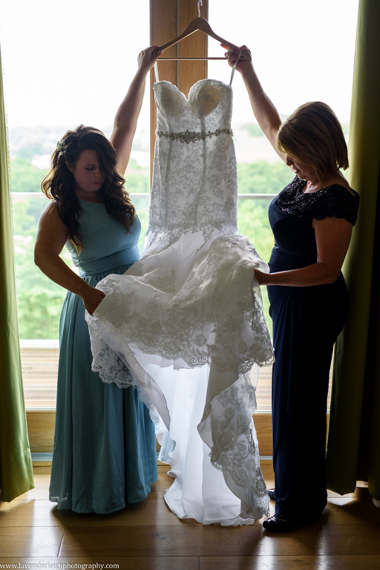 Mother and Daughter Holding Wedding Dress