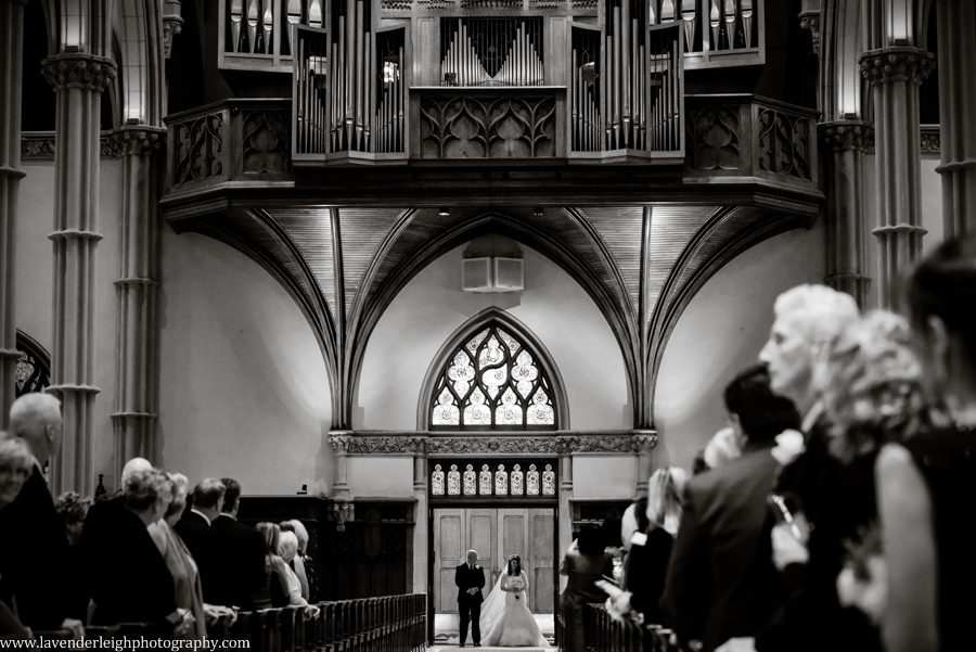 The bride stands at the entrance of St. Paul Cathedral