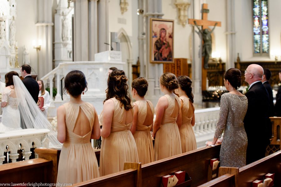 The bridesmaids watch the wedding ceremony at St. Paul Cathedral in Pittsburgh, Pennsylvania