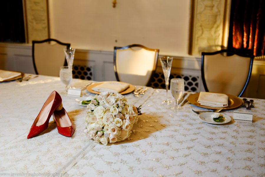 Red Shoes and Wedding Bouquet at the Omni William Penn wedding reception in Pittsburgh, Pennsylvania
