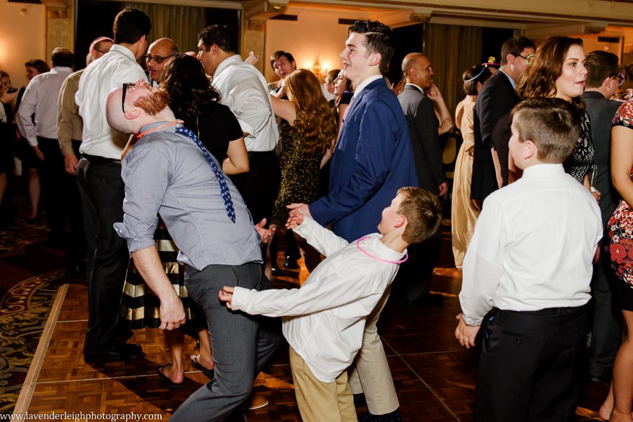Guests dance at a wedding reception at the Omni William Penn in Pittsburgh, Pennsylvania