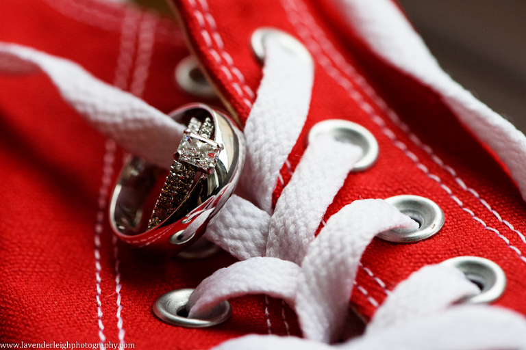 <alt>wedding rings on chuck taylor shoes</alt>