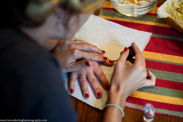 <alt>a bride's nails being painted</alt>