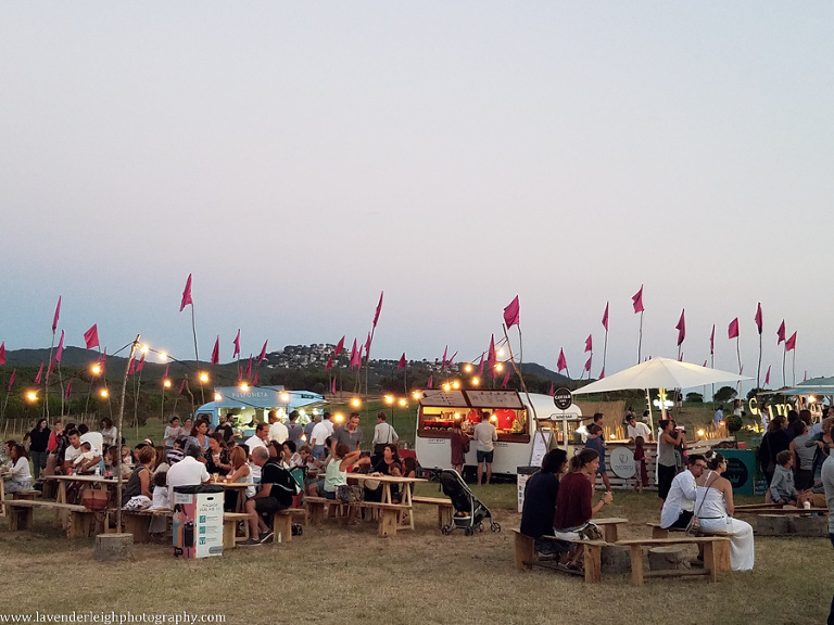 The atmosphere at this White Summer Festival was so charming!  I love the strung lights and the field of pink flags! 