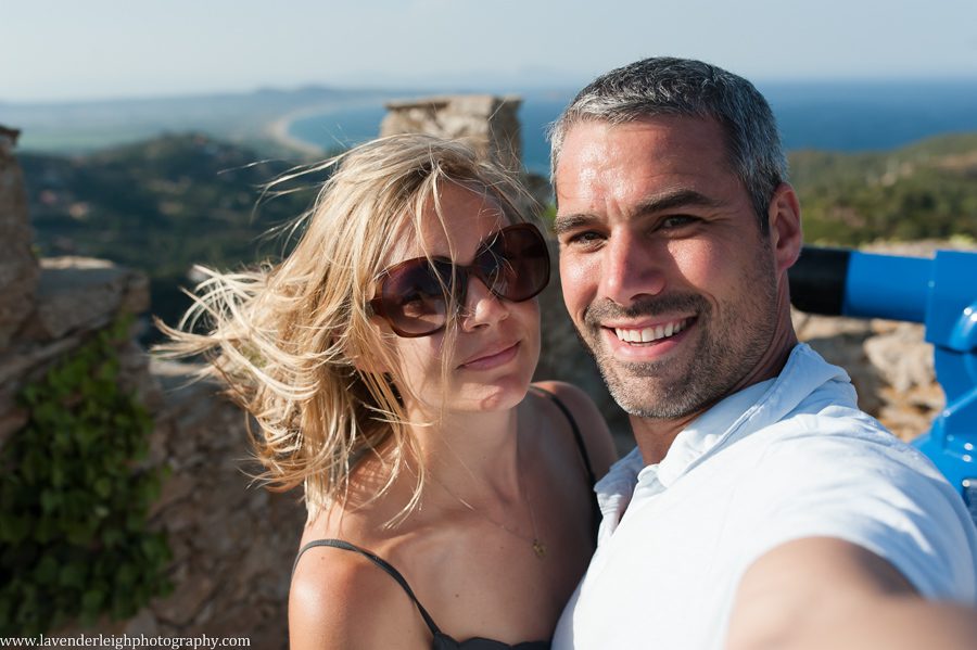 At the top of the castle, which didn't really look like a castle but the view was amazing.  I clearly wasn't ready for this photo and distracted by the wind! 