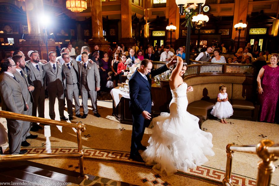 The groom spins his bride during their first dance at their The Grand Concourse Wedding Reception in Pittsburgh, Pennsylvania