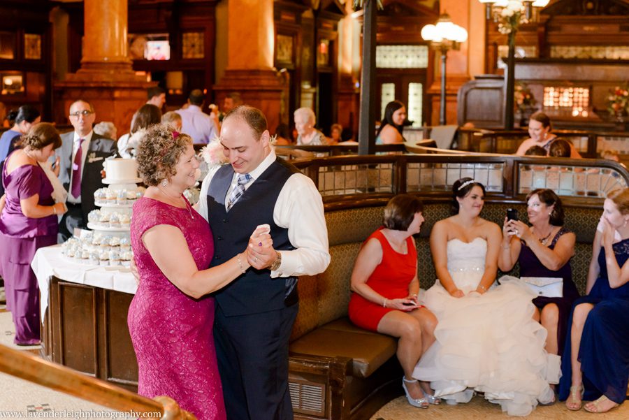 The groom and his mother dance during a wedding reception at The Grand Concourse in Pittsburgh, Pennsylvania
