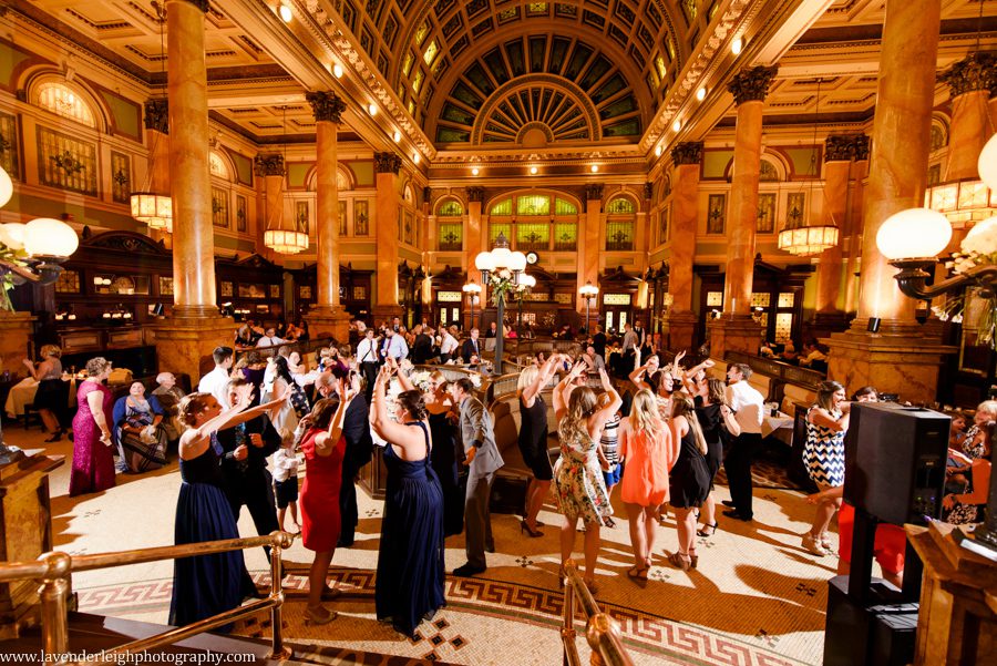 The guests have an amazing time on the dance floor at a wedding reception at The Grand Concourse in Pittsburgh, Pennsylvania