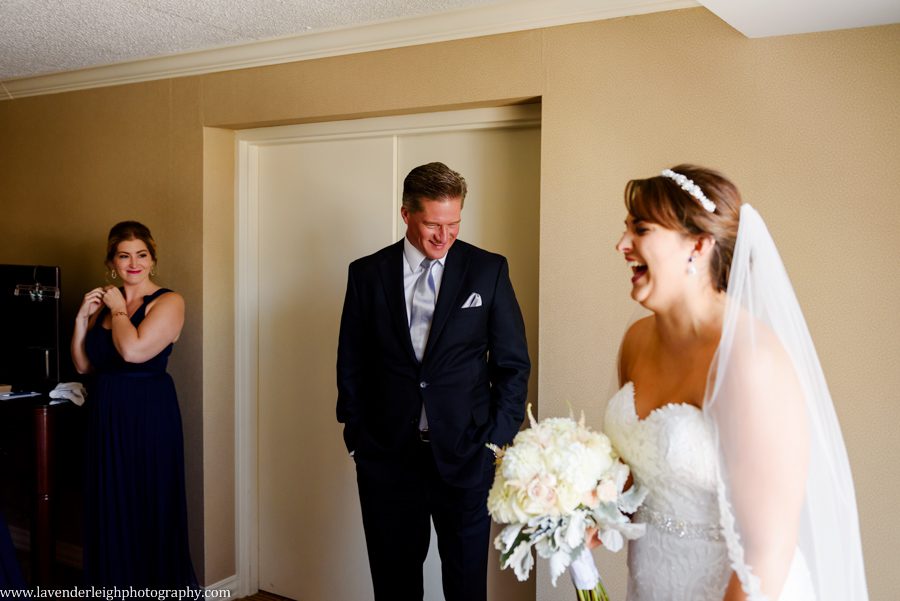 The father of the bride sneaks into the room to grab a glance at his beautiful daughter at Sheraton Station Square in Pittsburgh, Pennsylvania