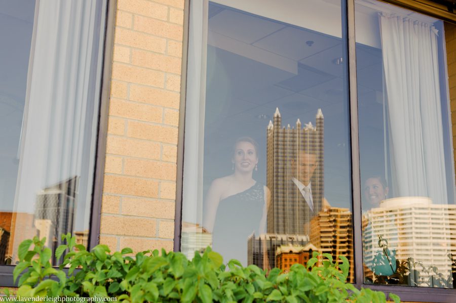 The bridal party watches the bride and groom have their first look at The Sheraton Station Square in Pittsburgh, Pennsylvania