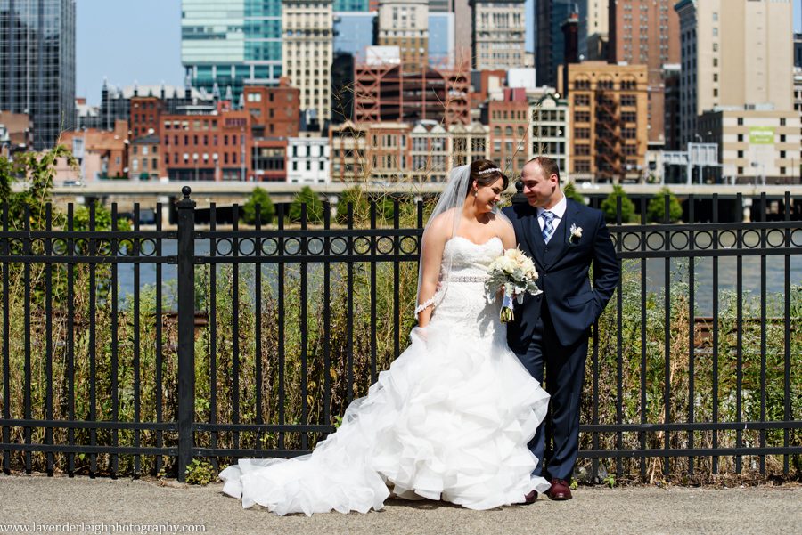 The bride and groom share a moment with the city of Pittsburgh in the background at the Sheraton Station Square.