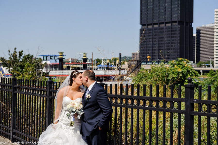 A bride and groom with a beautiful city backdrop at the Sheraton Station Square in Pittsburgh, Pennsylvania