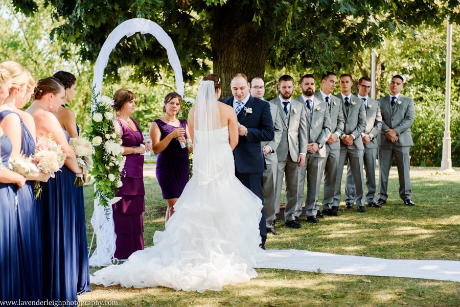 The groom reads his vows to his bride at the West End Overlook in Pittsburgh, Pennsylvania