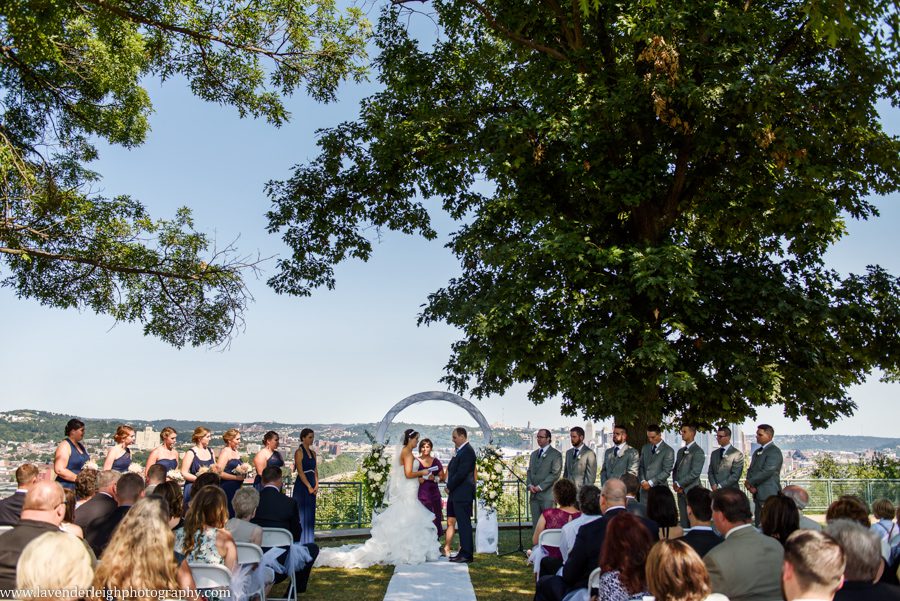 The bride and groom read vows at their wedding ceremony at the West End Overlook in Pittsburgh, Pennsylvania
