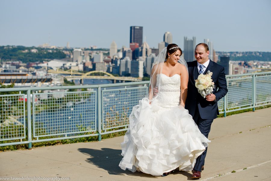 The bride and groom walk at the West End Overlook in Pittsburgh, Pennsylvania