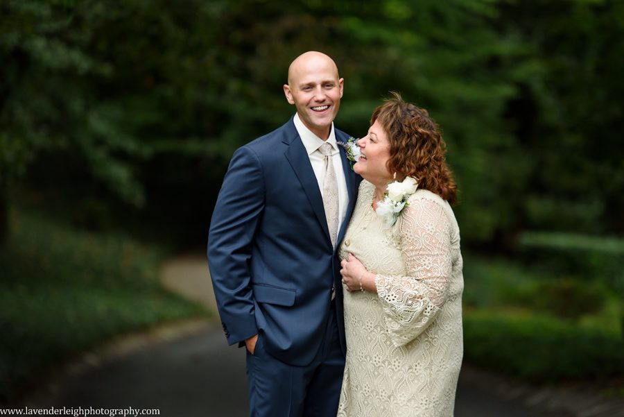 A groom taking a picture with his mother at  Greendance, the Winery at Sandhill in Mt. Pleasant, Pennsylvania