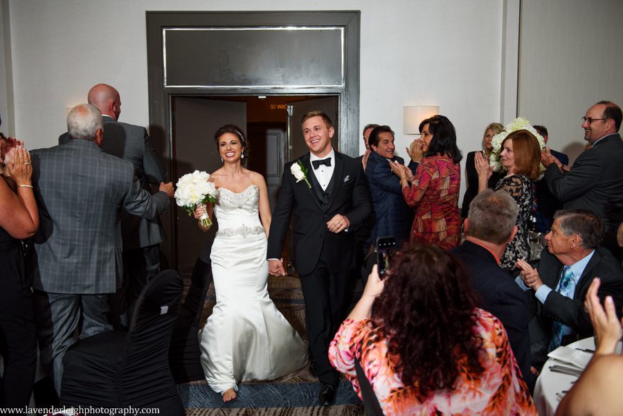 I love watching the joy of everyone cheering on the bride and groom as they enter the reception.