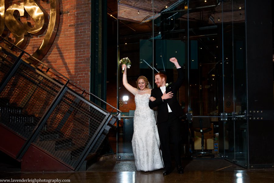 A bride and groom get introduced into their reception at the Heinz History Center