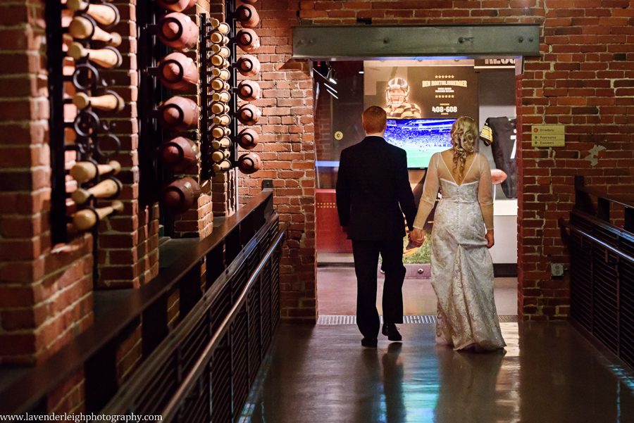 A bride and groom in the sports floor of the Heinz History Center