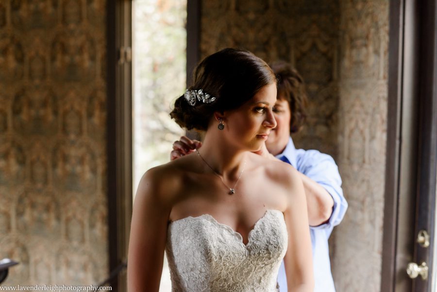 mother putting necklace on bride, the Hyeholde restaurant, castle, Pittsburgh Pennsylvania wedding and engagement photographer