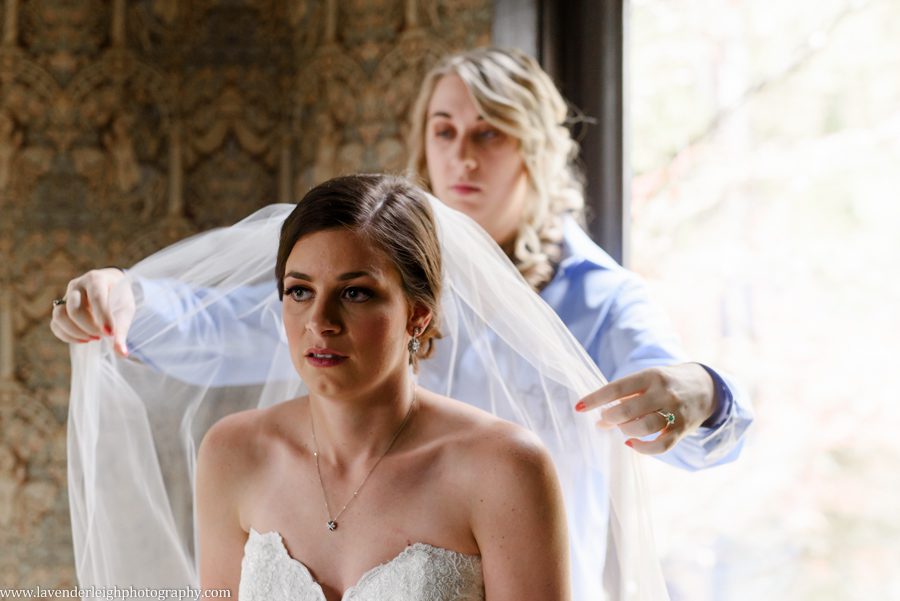Bridesmaid Fluffing Bride's Veil, the Hyeholde restaurant, castle, Pittsburgh Pennsylvania wedding and engagement photographer