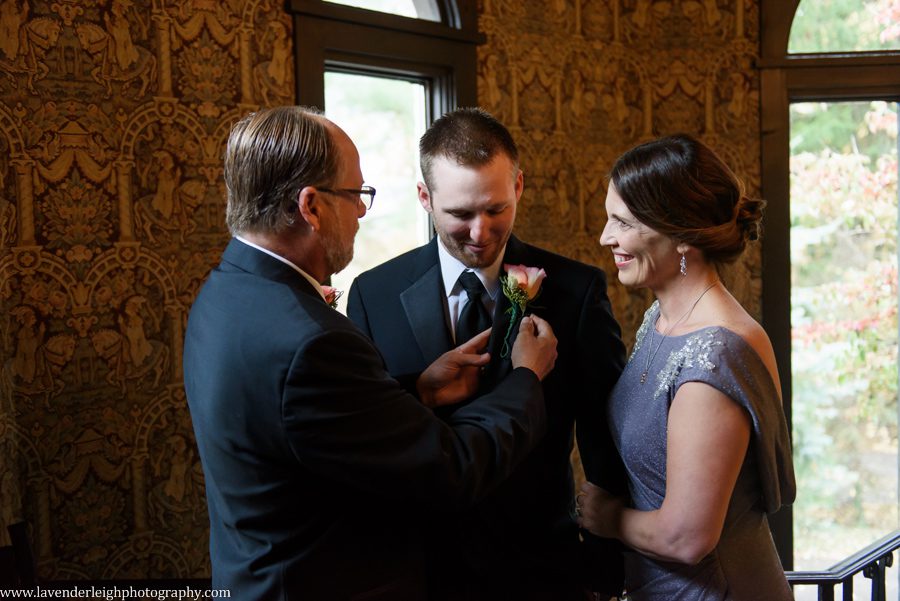 Father Putting Boutonniere on Groom, the Hyeholde restaurant, castle, Pittsburgh Pennsylvania wedding and engagement photographer